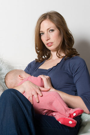 Breastfeeding baby in pretty v neck breastfeeding top