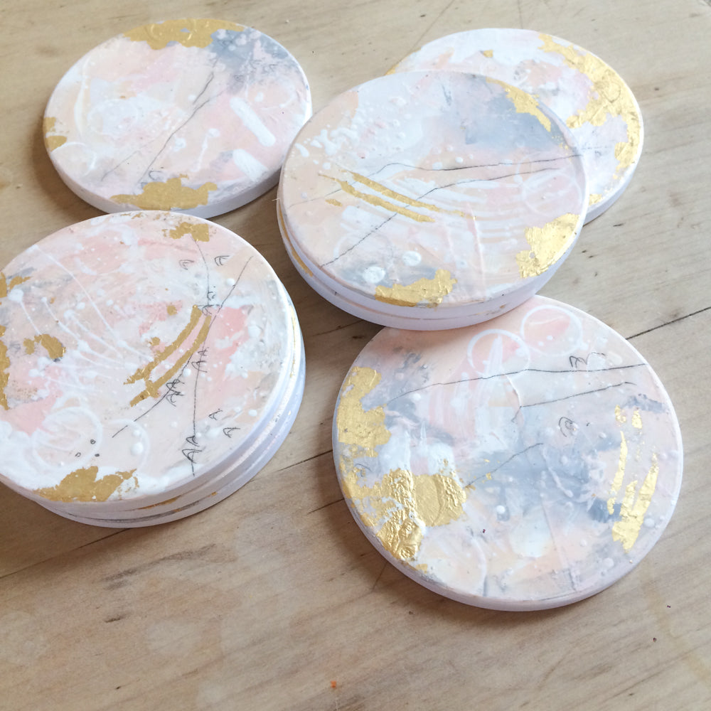Hand painted coasters in pink and gold